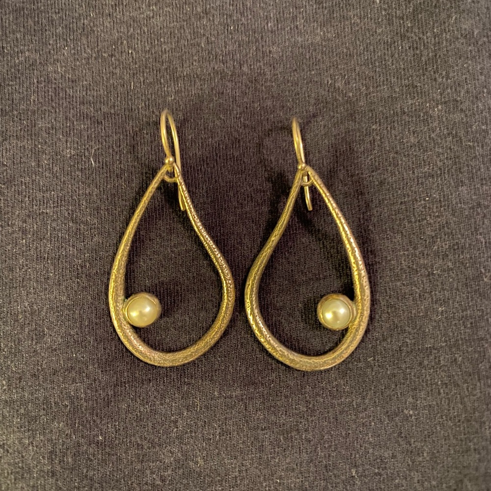 hoop earring with pearl.